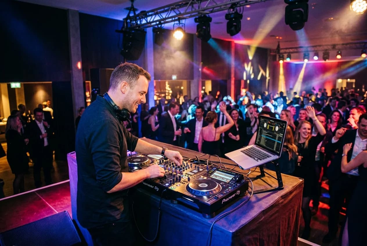 DJ performing at a corporate event in Cologne with professional sound and lighting
